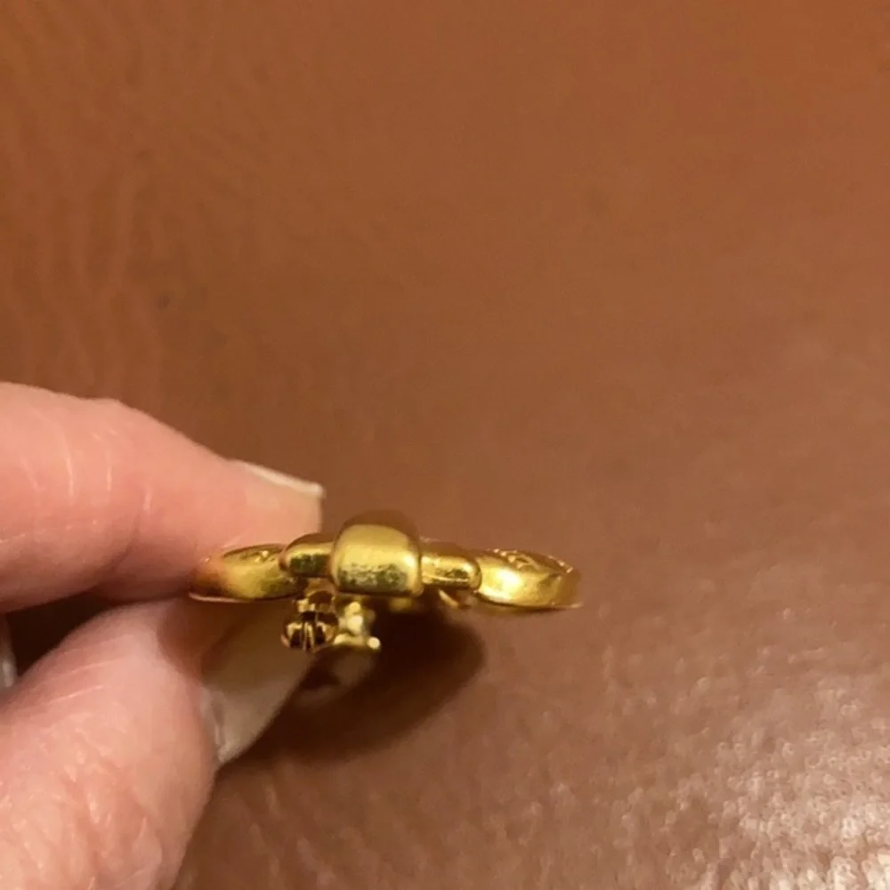 TAT signed gold tone Art Deco style pin